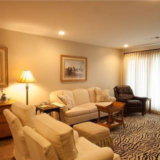 Cozy and elegantly furnished living room with soft lighting.