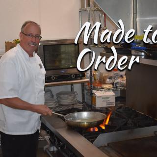 A chef preparing a dish in a restaurant kitchen with the caption 'Made to Order'.