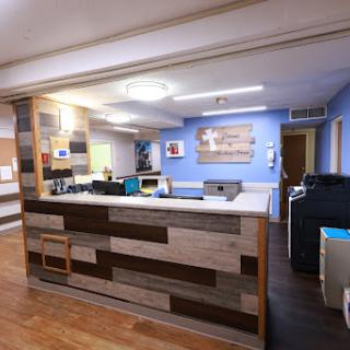 A modern reception area with a stylish design and workspace.