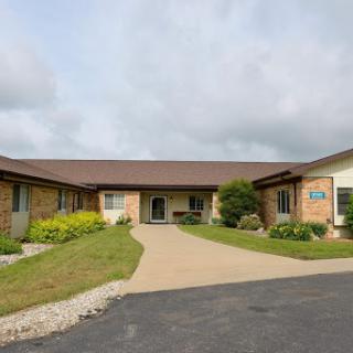 A peaceful residential building with well-maintained landscaping and a welcoming entrance.