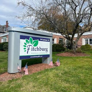 Welcome to Fitchburg - a glimpse of the community sign showcasing local pride.
