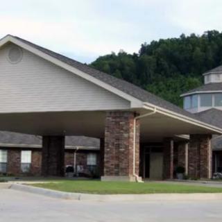 A suburban building with a large covered entrance and brick facade.