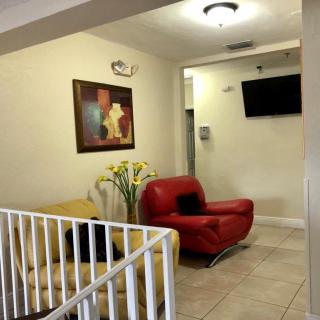 A cozy waiting room with comfortable seating and modern decor.