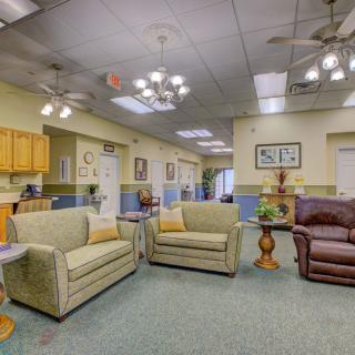 A cozy living room with comfortable seating and warm lighting.