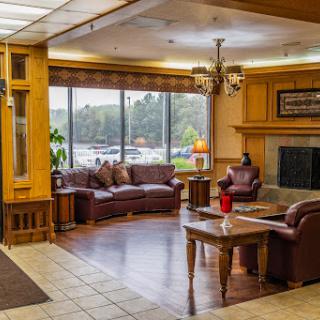 A warm and inviting lobby area featuring comfortable seating and natural light.