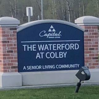 Sign for The Waterford at Colby, a senior living community.