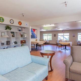 A cozy living room with ample seating and natural light.