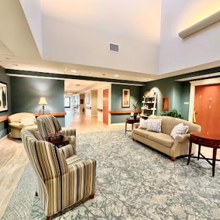 A cozy and inviting living room space with comfortable seating and soft lighting.