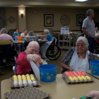 Elderly individuals engaging in a group activity at a nursing home.