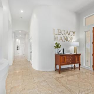 A sophisticated foyer of Legacy Manor showcasing modern design and elegance.