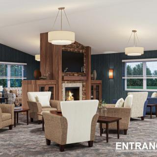 A modern living room with comfortable seating and a central fireplace.