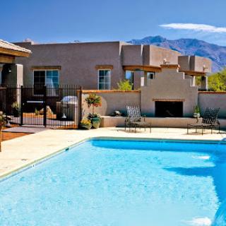 A serene residential pool area with stunning mountain views.