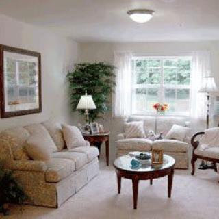 A cozy living room with comfortable seating and natural light.