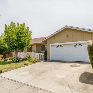 A suburban house with a two-car garage and a small front yard.
