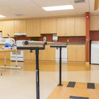 A well-equipped physical therapy room with various rehabilitation equipment.