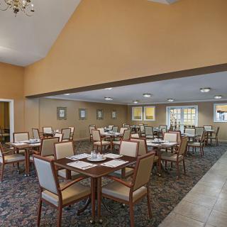Spacious dining area with neatly arranged tables and chairs.