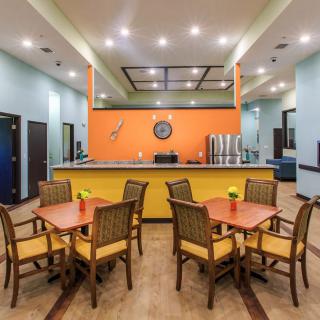 A modern dining space with colorful decor and comfortable seating.