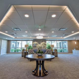 A spacious and elegantly designed lobby with modern furnishings and ambient lighting.