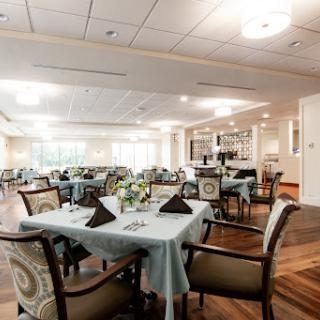 A beautifully arranged dining room with elegant tables and chairs, perfect for a cozy meal.