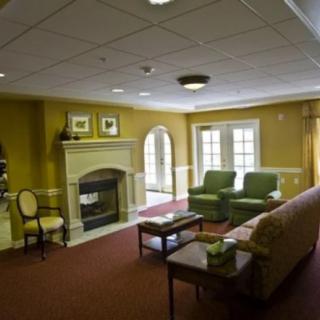 A cozy living room with a fireplace and comfortable seating.