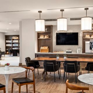 A modern lounge area with stylish furniture and lighting.