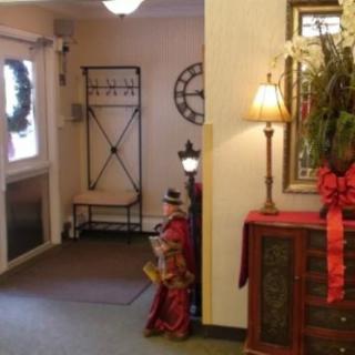 A warmly decorated entrance area adorned with festive decorations and elegant furnishings.