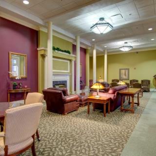 A cozy and elegant lounge area with comfortable seating and warm lighting.