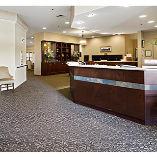 A modern office reception area with a spacious desk and well-lit interior.