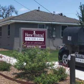 A welcoming senior care facility with clear signage and well-maintained landscaping.