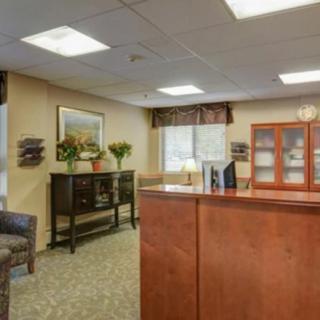 A warm and inviting reception area with comfortable seating and tasteful decor.