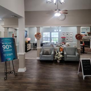 A cozy living room area featuring comfortable seating and elegant decor.