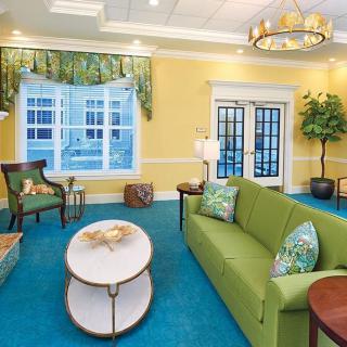 A cozy and stylish living room with vibrant colors and elegant furnishings.