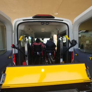 A view of the interior of a wheelchair-accessible van, showcasing its seating and accessibility features.