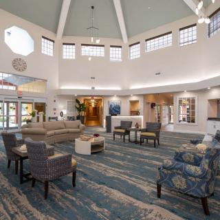 A spacious lobby with comfortable seating and modern decor.