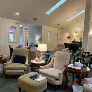 A cozy and inviting living room space with comfortable seating and soft lighting.
