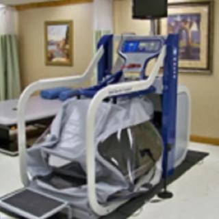 A specialized treadmill designed for physical rehabilitation and fitness training indoors.