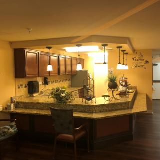 A modern kitchen with a stylish countertop and warm lighting.