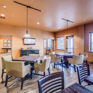 A cozy and modern lounge area with comfortable seating arrangements, perfect for casual gatherings.