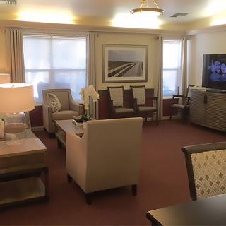 A cozy living room with comfortable seating and a television.