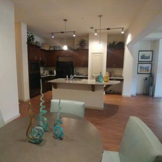 A modern, open-concept kitchen and dining area with contemporary decor.