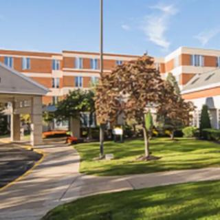 A healthcare facility with a landscaped exterior and entrance pathway.