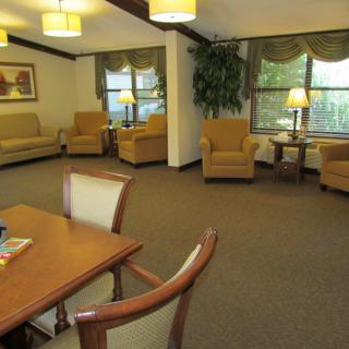 A cozy living room with comfortable seating and warm lighting.