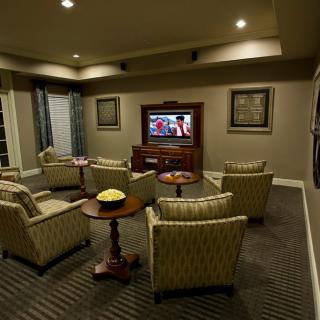 A cozy home theater setup with comfortable seating and a television.