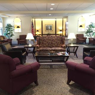 A well-furnished lobby with comfortable seating and elegant decor.
