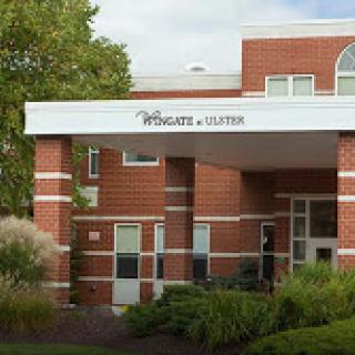 The entrance of a healthcare facility with a modern brick design.