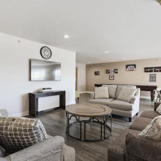 A modern and inviting living room featuring comfortable seating and stylish decor.
