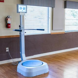 A body composition analyzer set up in a bright room, designed for fitness assessments.