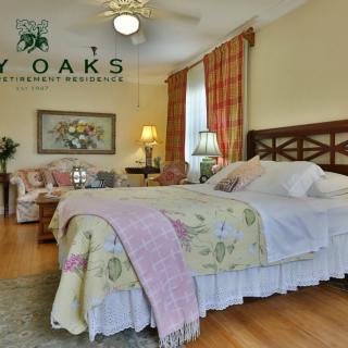 A cozy and well-decorated bedroom with elegant furnishings and warm lighting.