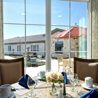 Elegant dining setup with a view of the outdoor patio.
