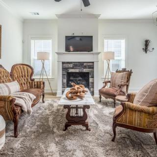 A cozy living room with classic furniture and a fireplace.